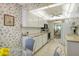 White kitchen with granite countertops and stainless steel appliances at 19 Whispering Sands Dr # 301, Sarasota, FL 34242