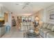 Spacious living room with view to dining area and ocean at 19 Whispering Sands Dr # 301, Sarasota, FL 34242
