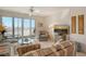 Light and airy living room with comfortable seating, beach views and access to the balcony at 19 Whispering Sands Dr # 301, Sarasota, FL 34242