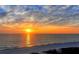 Beautiful sunset over the ocean with cloudy skies at 19 Whispering Sands Dr # 301, Sarasota, FL 34242