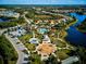 Aerial view of community with lake, pool, playground, and parking at 20345 Reale Cir, Venice, FL 34293