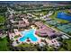 Aerial view of community pool, tennis courts, and clubhouse at 20345 Reale Cir, Venice, FL 34293