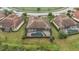 Aerial view of house with pool and surrounding homes at 20345 Reale Cir, Venice, FL 34293
