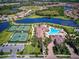 Aerial view of community amenities including pool, tennis courts, and clubhouse at 20345 Reale Cir, Venice, FL 34293