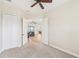 Bedroom with double doors opening to living area at 20345 Reale Cir, Venice, FL 34293