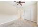 Spacious bedroom with ceiling fan and large closet at 20345 Reale Cir, Venice, FL 34293