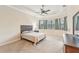 Spacious bedroom with bay window and ceiling fan at 20345 Reale Cir, Venice, FL 34293