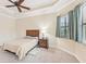 Bedroom with ceiling fan and window coverings at 20345 Reale Cir, Venice, FL 34293