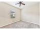 Bright bedroom with a ceiling fan and window at 20345 Reale Cir, Venice, FL 34293