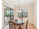Bright dining area with window and chandelier at 20345 Reale Cir, Venice, FL 34293