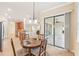 Casual dining area with sliding door to backyard at 20345 Reale Cir, Venice, FL 34293