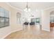 Open dining room with tile flooring and neutral decor at 20345 Reale Cir, Venice, FL 34293