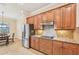 Modern kitchen featuring stainless steel appliances and ample cabinetry at 20345 Reale Cir, Venice, FL 34293