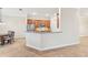 Open kitchen with breakfast bar and granite countertops at 20345 Reale Cir, Venice, FL 34293
