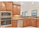 Well-equipped kitchen with granite counters and stainless steel appliances at 20345 Reale Cir, Venice, FL 34293