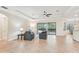 Spacious living room with tile flooring, and access to pool at 20345 Reale Cir, Venice, FL 34293
