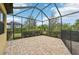 Spacious screened patio with paver flooring at 20345 Reale Cir, Venice, FL 34293