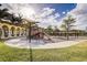playground with play structures and shaded areas at 20345 Reale Cir, Venice, FL 34293