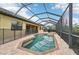 Inviting pool and spa with screened enclosure and paver deck at 20345 Reale Cir, Venice, FL 34293