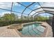 Screened pool and spa with brick pavers at 20345 Reale Cir, Venice, FL 34293