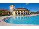 Resort-style pool with expansive deck and adjacent clubhouse at 20345 Reale Cir, Venice, FL 34293