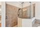 Large walk-in shower with glass enclosure and tile surround at 20345 Reale Cir, Venice, FL 34293