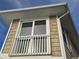 Exterior view of a dormer window with white railings at 215 Bahia Vista, Englewood, FL 34223