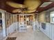 Under-renovation kitchen with ceiling fan, exposed framing and cabinets at 215 Bahia Vista, Englewood, FL 34223