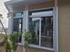 Sunroom with sliding glass doors and hurricane shutters at 215 Bahia Vista, Englewood, FL 34223