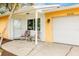 Front porch with two chairs and a view of the garage at 2232 Hively St, Sarasota, FL 34231