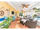 Large screened patio with pool view, comfortable seating and ceiling fans at 2232 Hively St, Sarasota, FL 34231