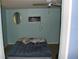 Small bedroom with an air conditioner and a full-size bed at 22342 Augusta Ave, Port Charlotte, FL 33952