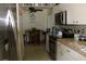 Galley kitchen with stainless steel appliances and granite countertops at 22342 Augusta Ave, Port Charlotte, FL 33952