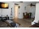 Living room with TV, seating, and small bar area at 22342 Augusta Ave, Port Charlotte, FL 33952