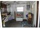 Large workshop area with workbench and storage shelves at 22342 Augusta Ave, Port Charlotte, FL 33952