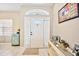 Front entry with decorative console table and arched window at 2421 Yalta Terrace, North Port, FL 34286