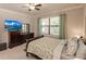 Serene bedroom with a large window, comfortable bed, and stylish furnishings at 2479 Brassica Dr, North Port, FL 34289