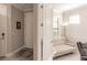 Bright entryway featuring white doors, neutral walls, and tile flooring, leading to a cozy interior at 2479 Brassica Dr, North Port, FL 34289