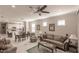 Inviting living room with an open floor plan, ceiling fan, and modern decor at 2479 Brassica Dr, North Port, FL 34289