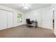 Home office with a desk and chair, offering ample natural light at 3405 Avenida Madera # B, Bradenton, FL 34210