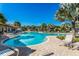 Resort-style community pool area featuring lounge chairs and lush tropical landscaping at 341 Grande Vista Blvd, Bradenton, FL 34212