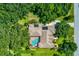 An aerial view showcasing a single Gathering home with a private pool at 3706 162Nd E Ave, Parrish, FL 34219