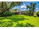 Home with large backyard, screened pool, and lush landscaping at 3706 162Nd E Ave, Parrish, FL 34219