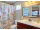 Clean bathroom with beach-themed decor and updated vanity at 3706 162Nd E Ave, Parrish, FL 34219