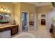 Spacious bathroom with a toilet, shower, and double vanity at 3706 162Nd E Ave, Parrish, FL 34219