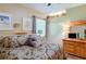 King-size bedroom with wood furniture and large windows at 3706 162Nd E Ave, Parrish, FL 34219