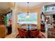 Bright breakfast nook with pool view, seating for four at 3706 162Nd E Ave, Parrish, FL 34219