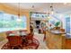 Bright breakfast nook with a view of the pool and a unique chandelier at 3706 162Nd E Ave, Parrish, FL 34219
