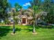 Dream home with palm trees and a lush green lawn at 3706 162Nd E Ave, Parrish, FL 34219