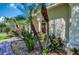 Landscaped entryway with palm trees and brick path at 3706 162Nd E Ave, Parrish, FL 34219